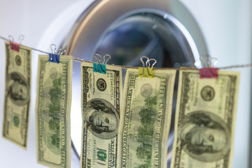 background. defocusing. one hundred dollar bills after washing. offshore money laundering.