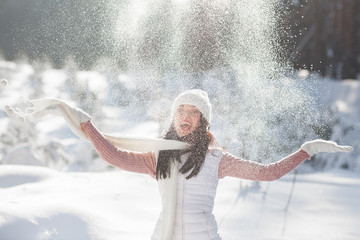 Cheerful young woman outdoors in winter