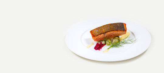 Salmon Steak on a white plate on a white background