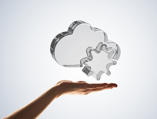 Cloud computing concept with glass symbol shown in hand