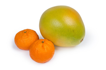 Pomelo and two mandarin oranges on a white background