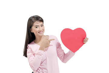 Portrait of asian woman showing red heart shaped