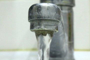 Old sink mixer. Close-up. Background.