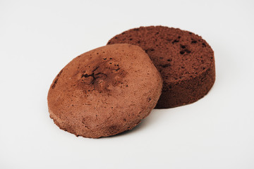 close-up view of delicious sliced chocolate cake isolated on white