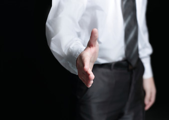 close up.businessman reaching out for a handshake