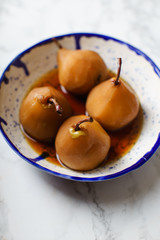 Tea poached pears with anise, cinnamon and other spices