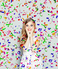 Happy surprised woman on holiday confetti background