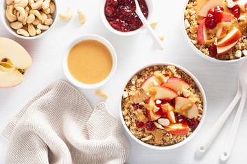 apple peanut butter quinoa bowl with jam and cashew for healthy breakfast