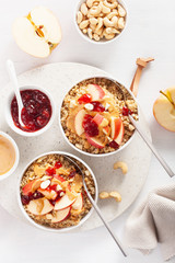 Obraz na płótnie Canvas apple peanut butter quinoa bowl with jam and cashew for healthy breakfast