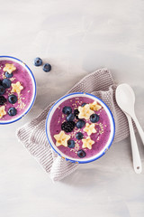 healthy berry smoothie bowl with banana and sesame seed