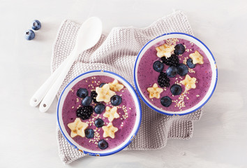 healthy berry smoothie bowl with banana and sesame seed