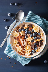 healthy banana smoothie bowl with blueberry chocolate walnuts