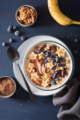 healthy banana smoothie bowl with blueberry chocolate walnuts