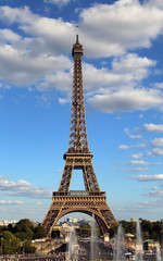 Eiffel Tower symbol of in Paris city in France with clouds seen