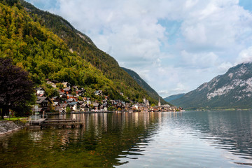 Fototapeta na wymiar Hallstatt town in Austria with Alpine lake and picturesque mountains around.