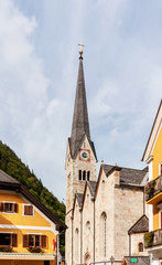 Fototapeta na wymiar Hallstatt evangelic church vertical photo on sunny day.