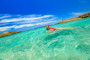 Woman snorkeling in a tropical pool of Albany Region in Western Australia. Watersport activity in...