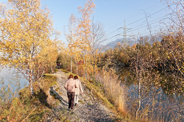 Locals hiking at autumnal banks of Old Rhine