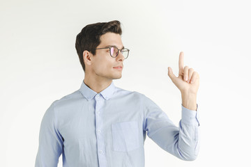 Handsome man pointing finger up.