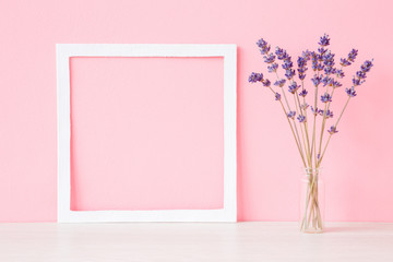 Dried, purple lavender in vase at pink wall. Soft pastel color. Mockup for positive idea. Empty...