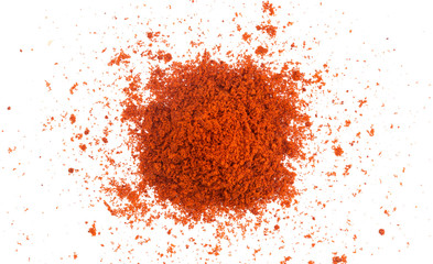 Pile of red paprika powder isolated on white background. Top view