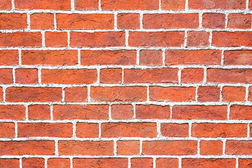 Rustic red brick wall with white concrete lines pattern texture.