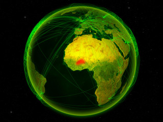 Burkina Faso from space on planet Earth with digital network representing international communication, technology and travel.