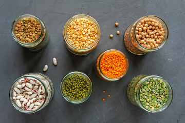 Died lentils and pulses in open glass kitchen jars
