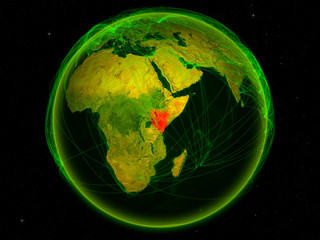 Kenya from space on planet Earth with digital network representing international communication, technology and travel.