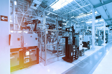 Factory for the production of cars in blue. Modern automotive industry. Blue tone