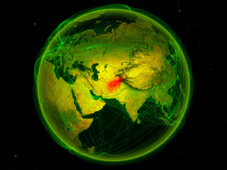 Afghanistan from space on planet Earth with digital network representing international communication, technology and travel.