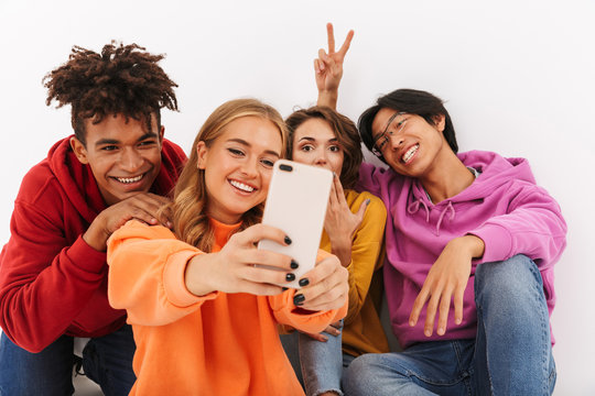 Group of cheerful teenagers isolated