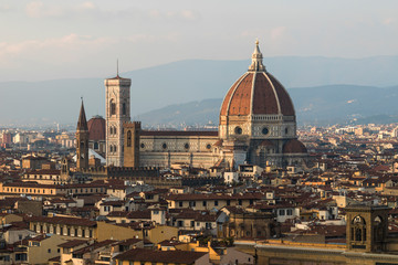 Fototapeta na wymiar Panoramic view of Florence, Italia, at sunset. Famous view on Firenze and Santa Maria del Fiore Cathedral from the Michelangelo Square (Piazzale Michelangelo) in Florence, Tuscany, Italy. - Image
