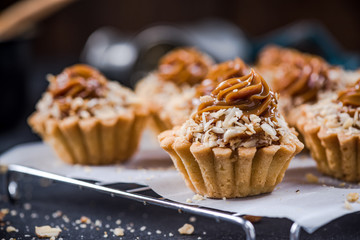 Homemade satled caramel cupcakes on tray