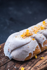 Poppy seed Christmas cake with icing and candied orange