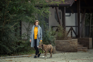 Girl walking with a dog