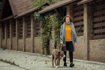 Girl walking with a dog