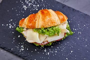 croissant with ham in the cafe