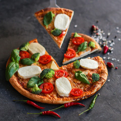 pizza, broccoli, tomato sauce, cheese and more. food background