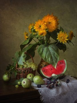 Still life with beautiful autumn bouquet and fruits
