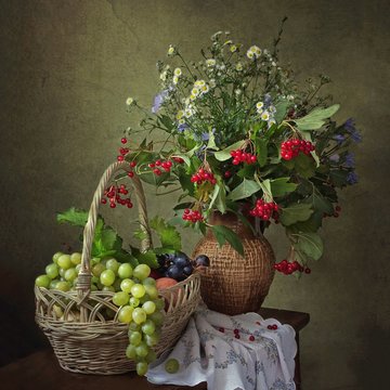 Still life with beautiful autumn bouquet and fruits