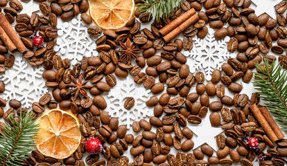 Coffee beans with aroma spices and christmas decorations background