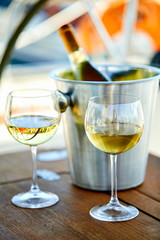 Pair of wineglasses against the yacht