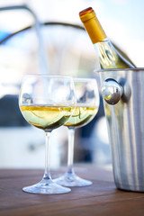 Pair of wineglasses against the yacht