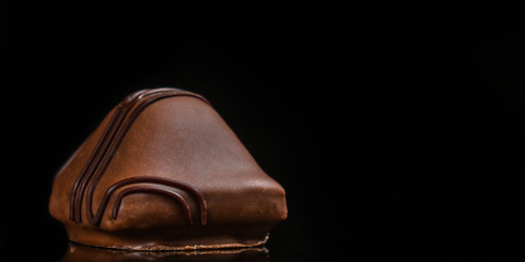 candies, chocolate, filler, cream, coffee (Black background). copy space