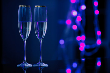 A pair of glasses of champagne in the interior. Holiday's concept.
