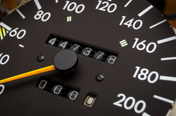 Close up shot of a speedometer in a car. Car dashboard. Dashboard details with indication lamps.Car...