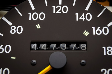 Close up shot of a speedometer in a car. Car dashboard. Dashboard details with indication lamps.Car...