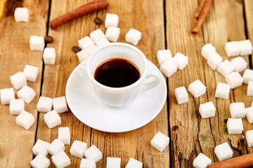 One cup of coffee espresso near sugar cube