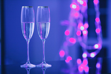 A pair of glasses of champagne in the interior. Holiday's concept.
